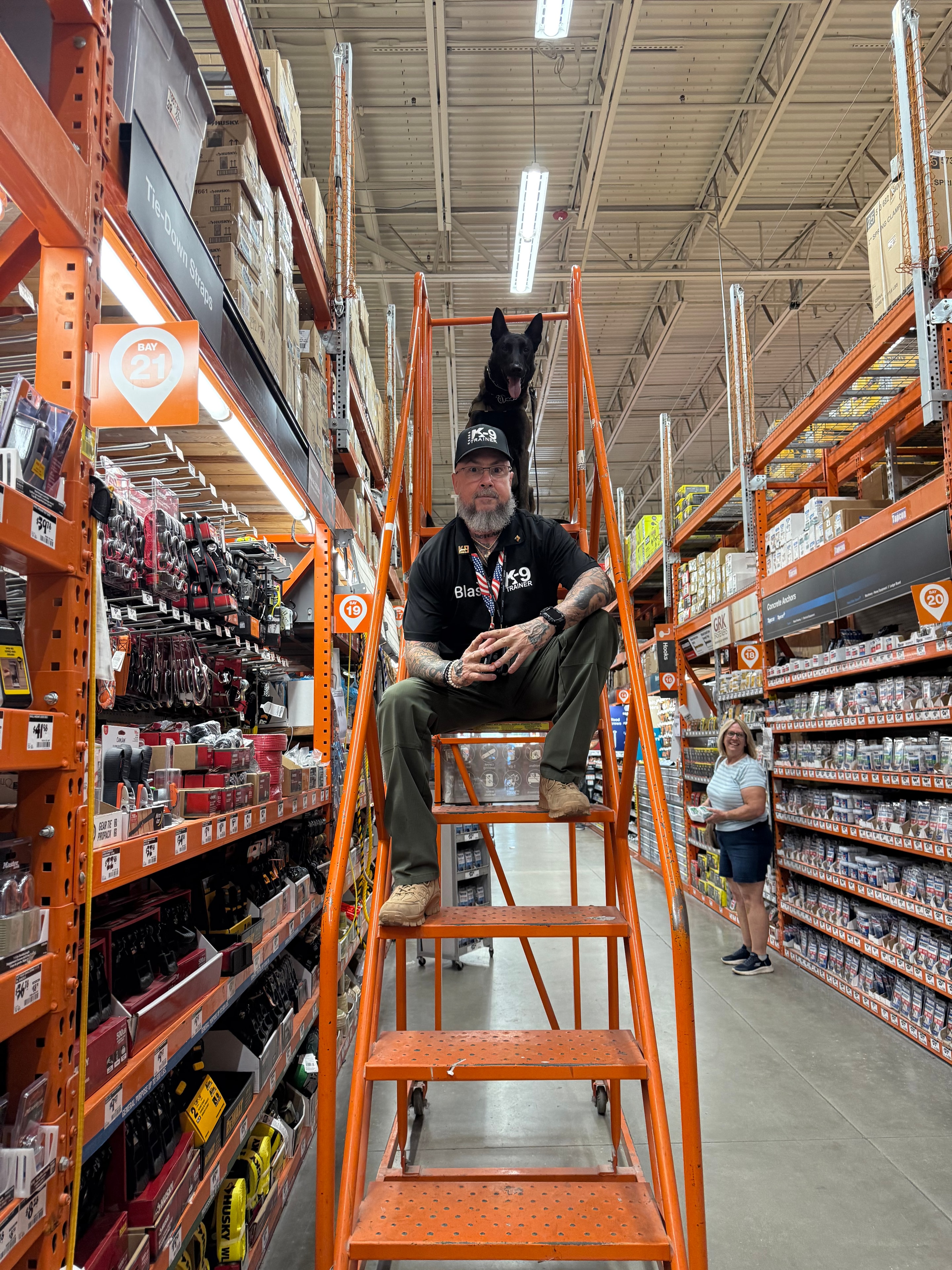 Blas L. Cardenas with a dog at a hardware store